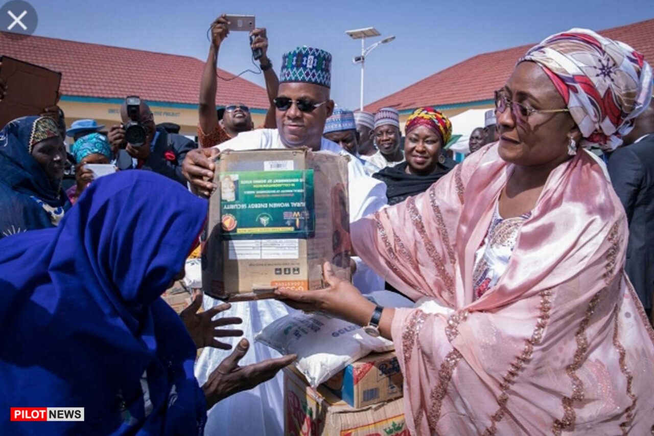 https://www.westafricanpilotnews.com/wp-content/uploads/2021/05/Buhari-Mrs-Aisha-Buhari-presenting-gift-items-to-the-less-previleged-5-17-21-1280x853.jpg